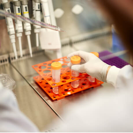 researchers with test tubes